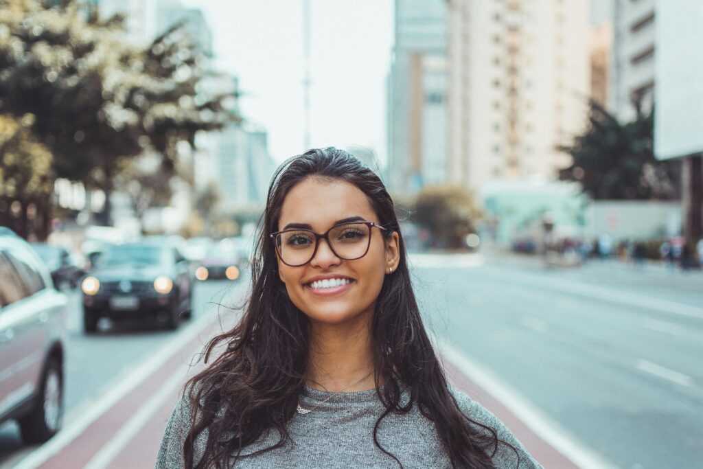  a smiling woman on the street