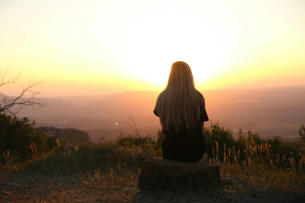 a woman watching the sunset