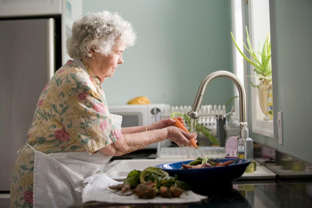 grandma washing vegetables